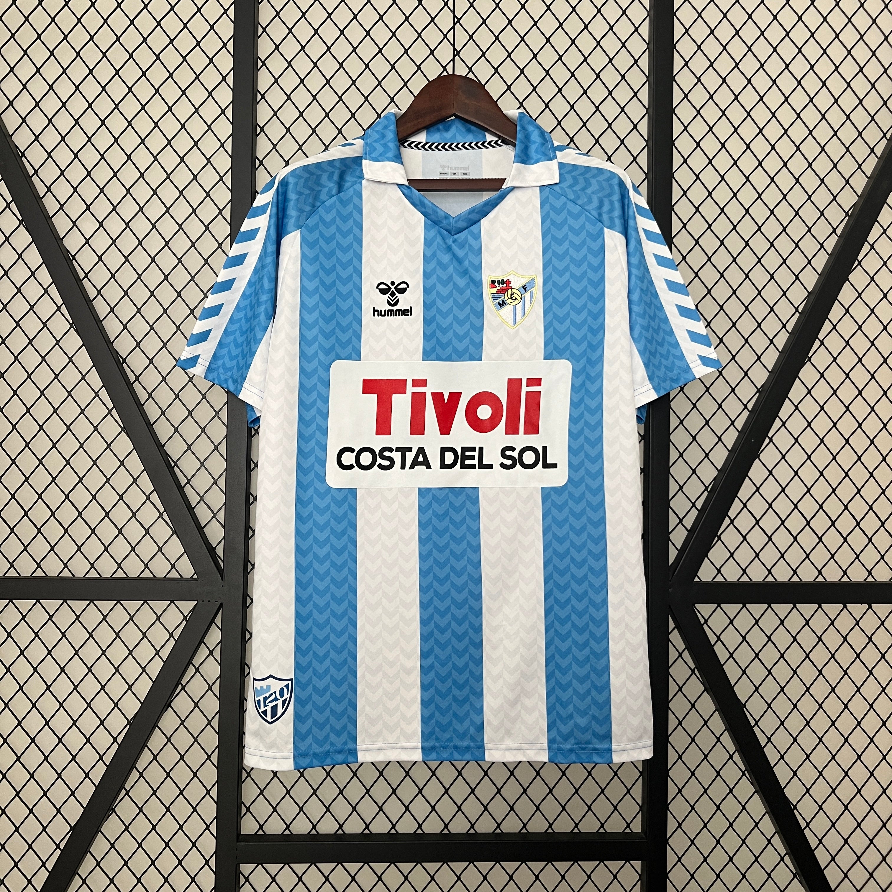 Malaga CF 120th Anniversary home jersey.