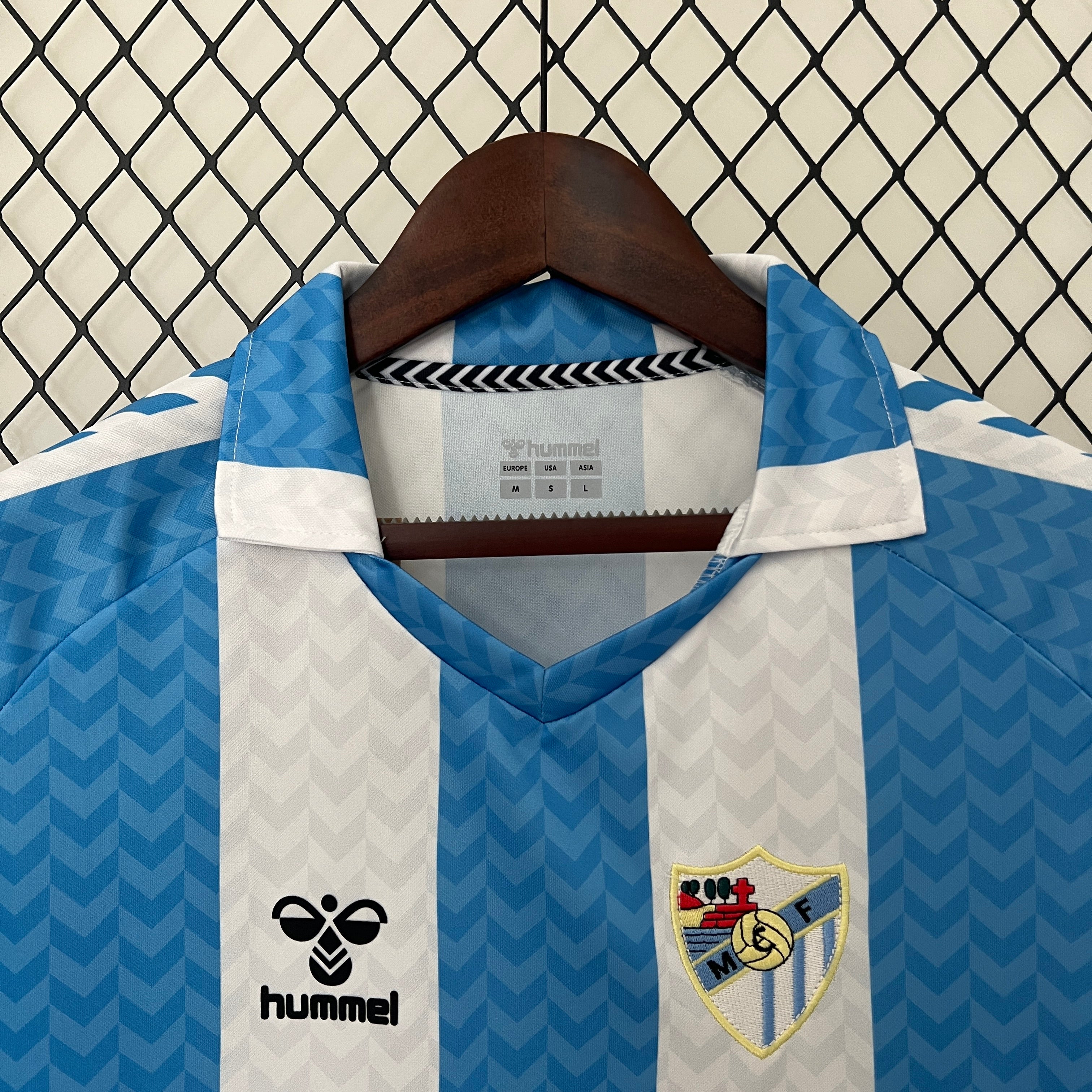 Malaga CF 120th Anniversary home jersey.