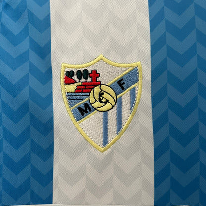 Malaga CF 120th Anniversary home jersey.