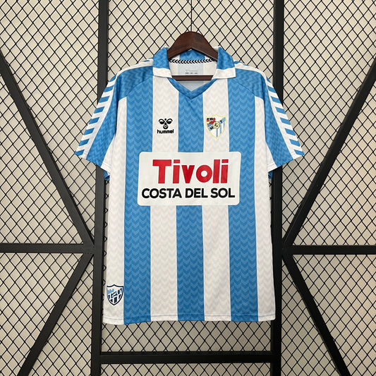 Malaga CF 120th Anniversary home jersey.
