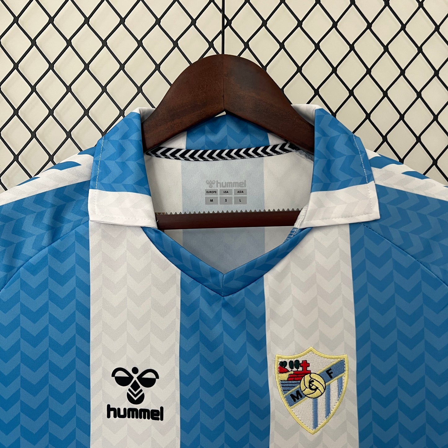Malaga CF 120th Anniversary home jersey.