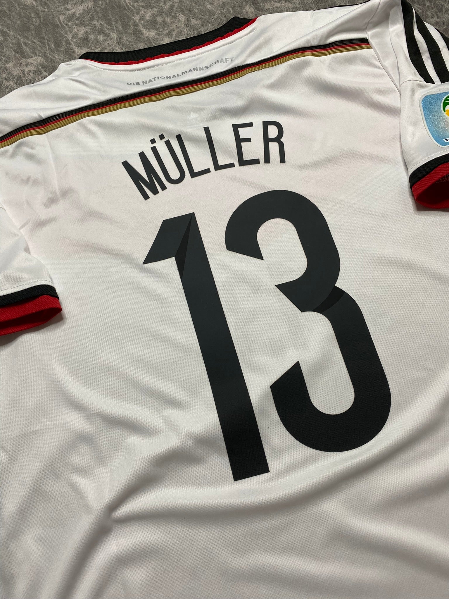 Germany's home jersey for the 2014 World Cup. Thomas Muller
